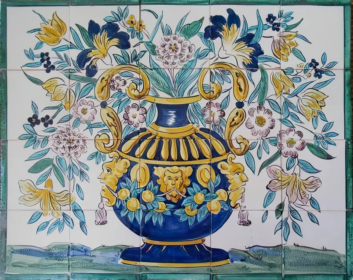 Portuguese azulejo tile mural depicting an ornate blue and yellow vase filled with flowers and green foliage, framed by a green border.