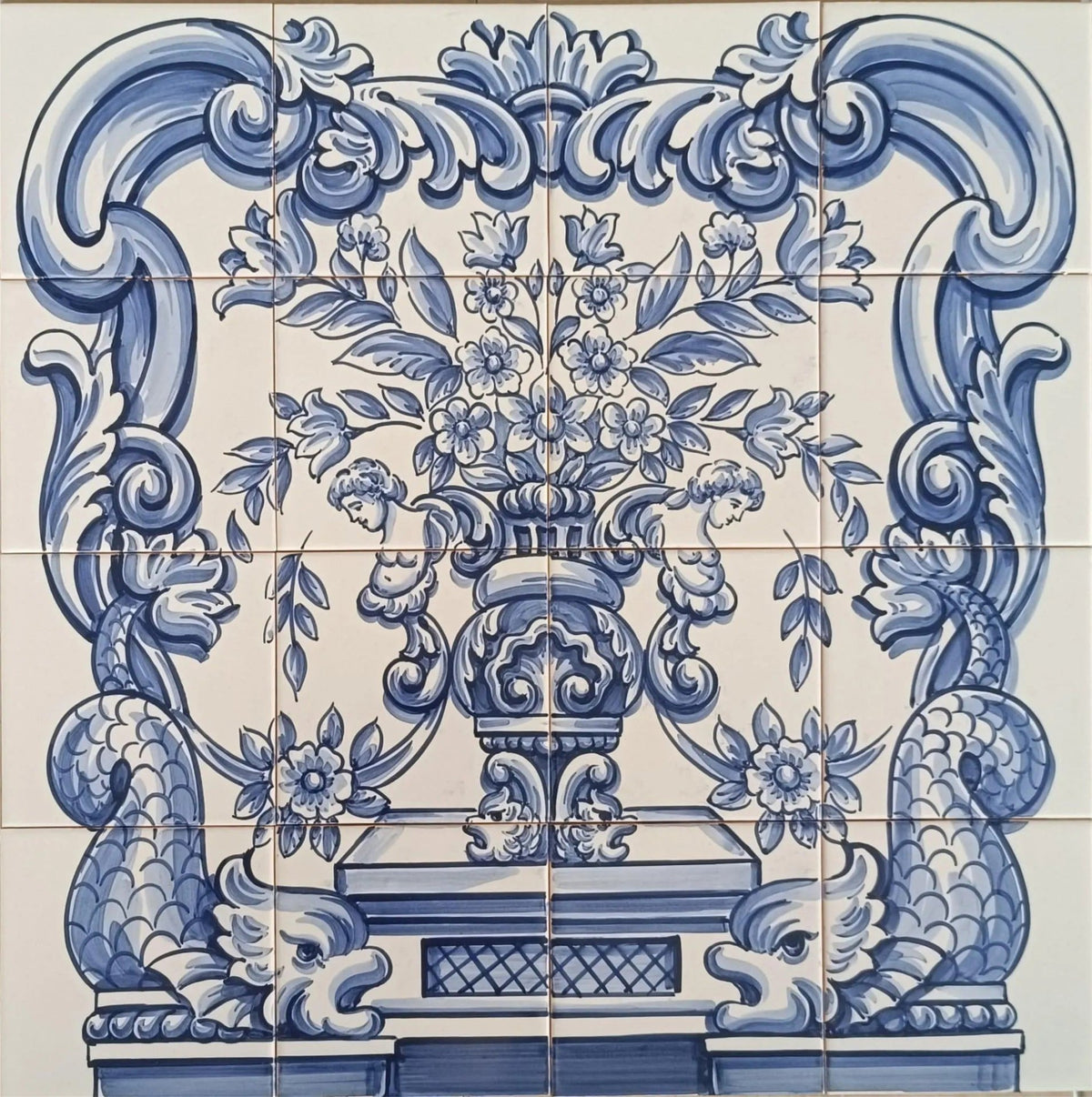 Decorative Portuguese tile mural with floral vase and dragon design. 