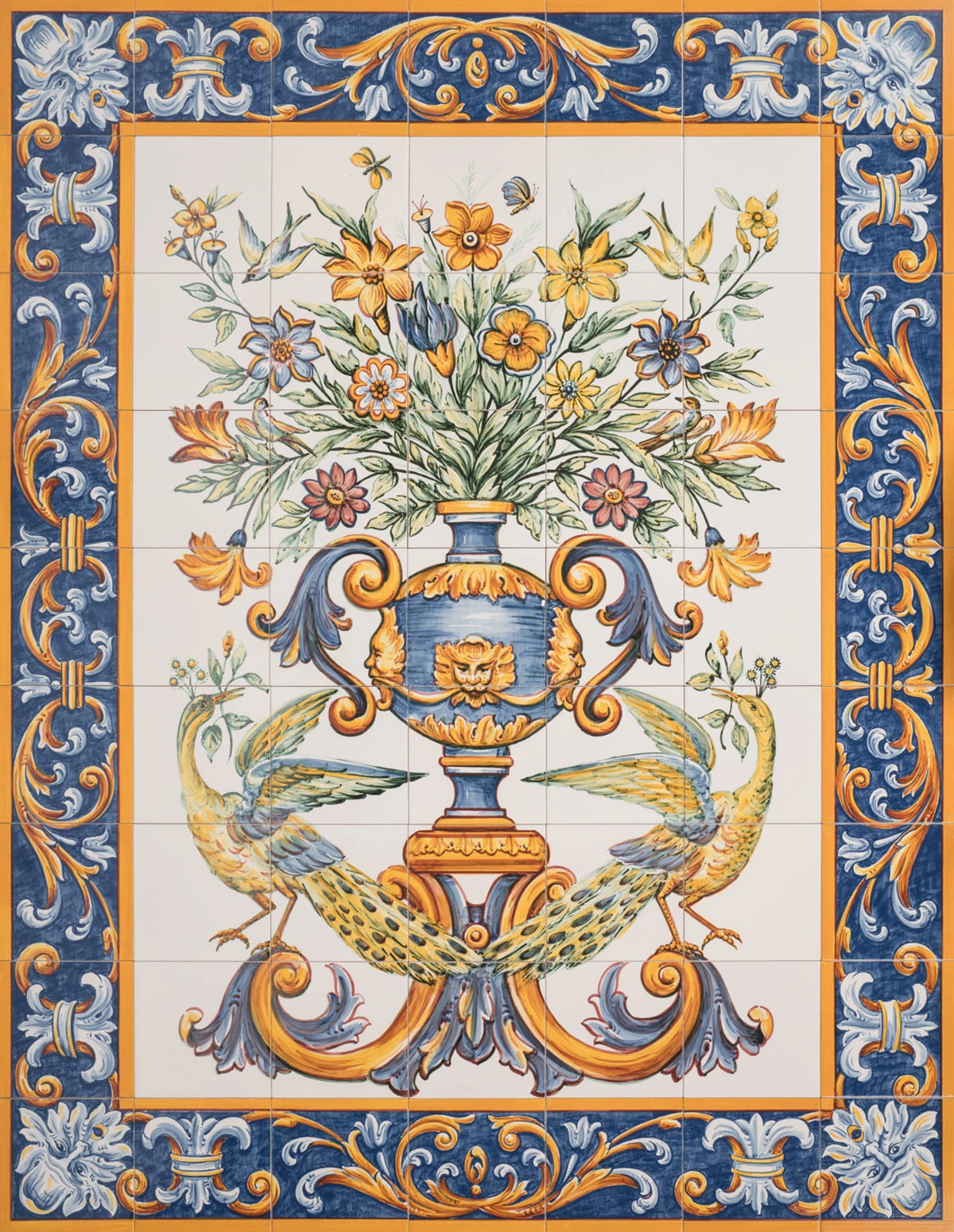 A hand-painted tile mural featuring a vase of flowers with a blue and gold floral pattern on a yellow background, and ornate borders.