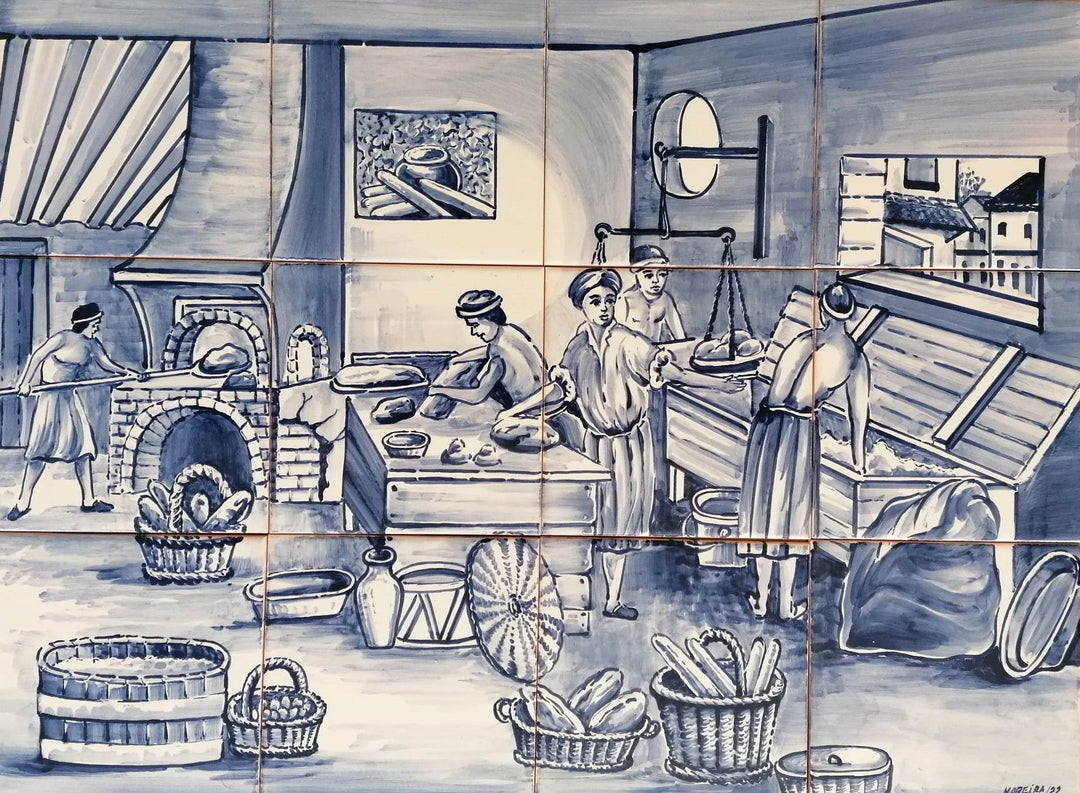 Blue and white Portuguese azulejo tile mural depicting a traditional bakery with bakers preparing dough, a brick oven and baskets of bread.