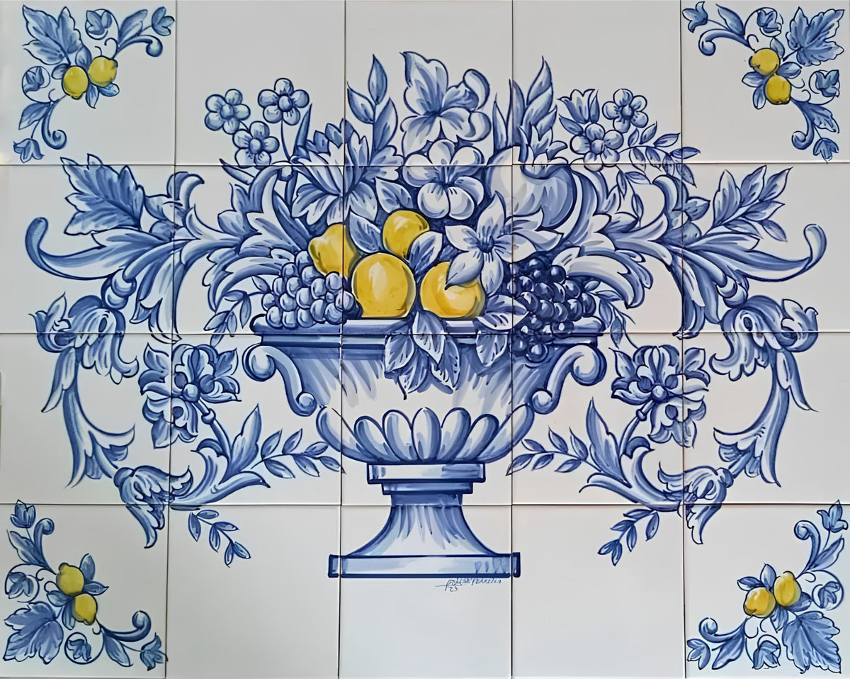 Blue and white Portuguese ceramic tile wall mural featuring a classical floral and fruit design with lemons, grapes, and scrolling foliage in a pedestal urn motif.