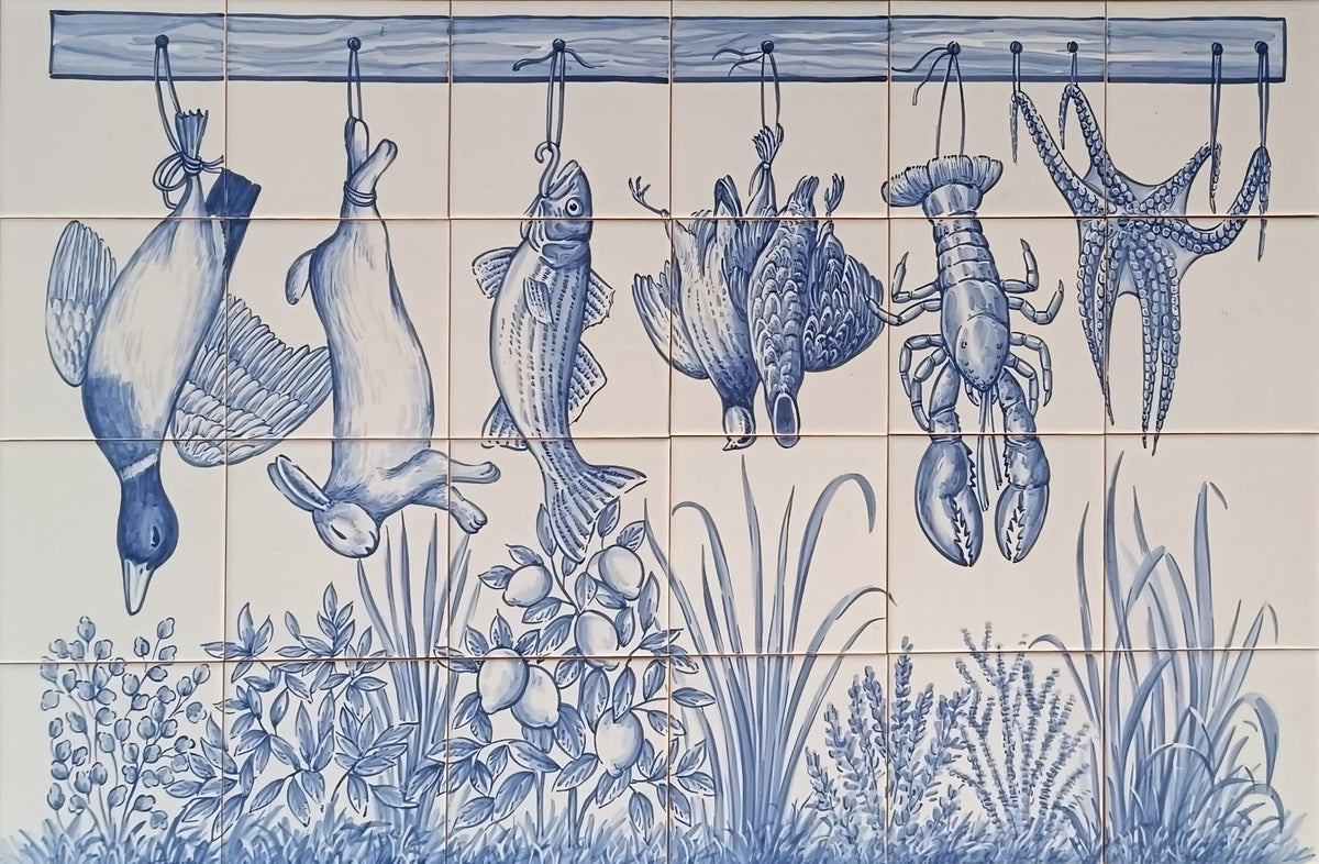 Blue and white kitchen tile wall mural featuring hanging fish, a duck, a lobster, an octopus, and coastal plants.