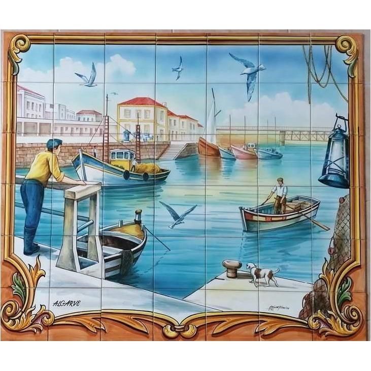 Portuguese azulejo tile mural depicting an Algarve harbour with fishing boats, fishermen, seagulls and waterfront buildings, framed by an ornate golden border.