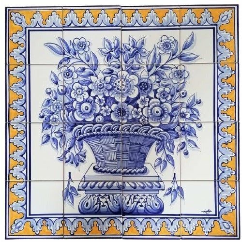 Portuguese tile mural depicting a blue-and-white flower basket on a decorative pedestal, framed by a yellow and blue ornamental border.